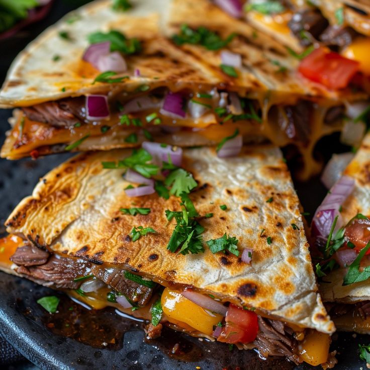 Steak Cheese Quesadillas with Grilled Onions and Melty Cheese on Blackstone